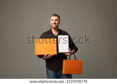 men holding a box, person holding a cardboard box, shopping