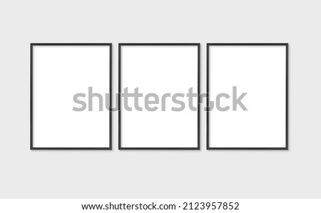 The layout of the frame is 3x4, 30x40. Set of three thin black frames. Gallery wall mockup, set of 3 frames. Clean, modern, minimalistic, bright. Portrait. Vertical.