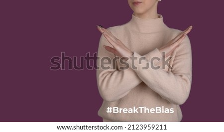 Break the bias symbol of woman's international day. Crossed hands. Woman arms crossed to show solidarity, breaking stereotypes, inequality  Royalty-Free Stock Photo #2123959211