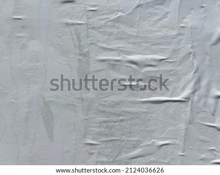 contemporary artistic style creased wrinkled white street poster paper with negative space Royalty-Free Stock Photo #2124036626