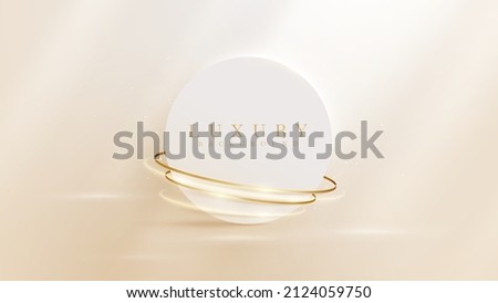 Circle frame with gold ribbon decoration and glitter light effect element. Cream luxury background. Royalty-Free Stock Photo #2124059750