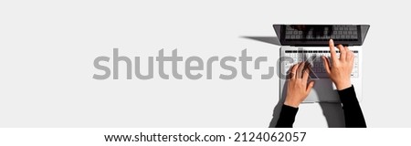 Person using a laptop computer from above Royalty-Free Stock Photo #2124062057