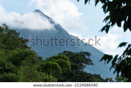 Marumbi peak in the Atlantic Forest of Paraná, in the midst of clouds Royalty-Free Stock Photo #2124088340