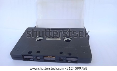 Classic 90's cassette tape in black on a white background