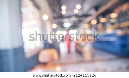 Blurry shopping mall background of store grocery. Blurred background shopping mall light bokeh business event retail store. Blur Convention hall center audience present display goods shelf products