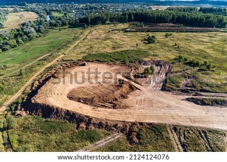 Removal of overburden on a piece of land before sand pit mining, aerial view Royalty-Free Stock Photo #2124124076
