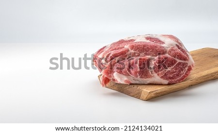 Raw pork on wooden board. Raw meat. Raw pork meat - neck or belly. Fresh meat on cutting board. piece of raw lamb meat. Butchery, market. isolated on white background Royalty-Free Stock Photo #2124134021