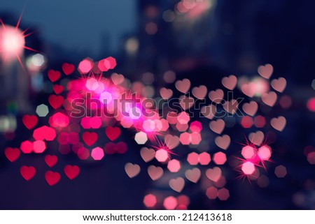 Color Bokeh on a dark background with hearts for backgrouds.