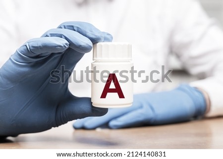 Vitamin A in medical jar. . High quality photo