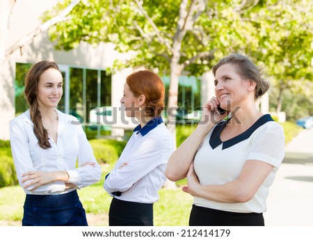 Portrait happy, smiling corporate worker talking on mobile phone, isolated background company female employee having conversation outside office on sunny summer day. Positive face expression, emotions