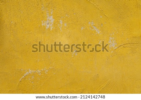 mustard yellow cement wall texture background has scratches and scuff marks. Royalty-Free Stock Photo #2124142748