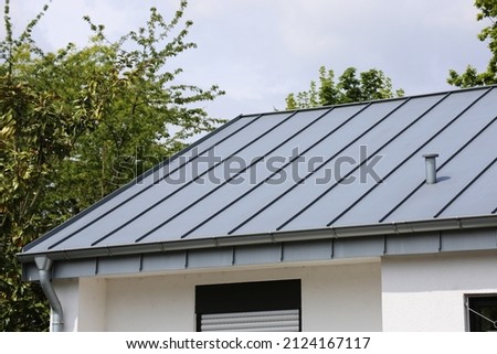 Residential house with standing seam roof Royalty-Free Stock Photo #2124167117