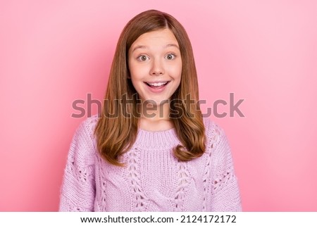 Portrait of attractive cheerful amazed glad teen girl good mood enjoying isolated over pink pastel color background