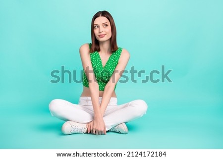 Full body photo of youth pretty lady wonder look empty space think isolated over turquoise color background