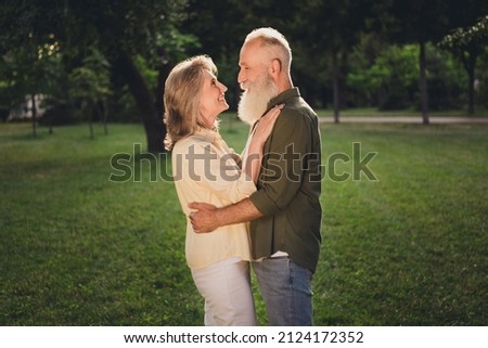Profile photo of flirty emotion pensioner grey hair couple hug wear trend shirts outside spend free weekend