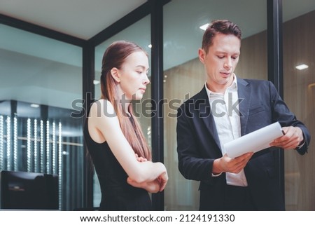 Business colleague using digital tablet working discussing together at modern office