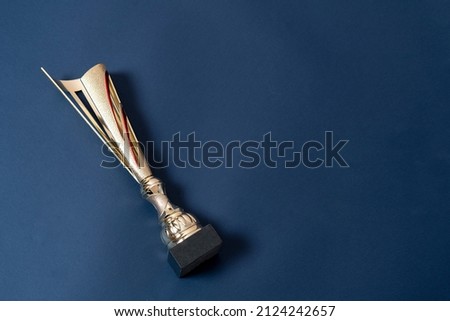 golden cup award for the first place achievment, competition winner concept