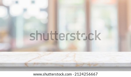 marble table top with blurred kitchen cafe restaurant interior background Royalty-Free Stock Photo #2124256667