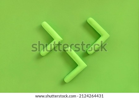 Green arrows pointing right side. Three dimensional arrow sign showing direction on neutral background. Development  concept, go green or heading target metaphor, striving for the goal, going forward.