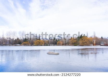 Upside down boat on the frozen lake of Puigcerda in winter