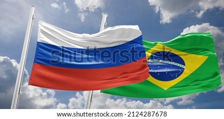 Russian and Brazilian flags flutter together in the wind On February 16, Vladimir Putin will hold talks with Brazilian President Jair Bolsonaro Royalty-Free Stock Photo #2124287678