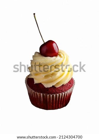 red velvet cupcake with cherry and cream 