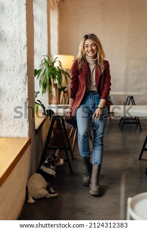 Picture of smiling adult woman, taking a short break from work.