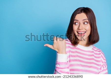 Photo of impressed bob hairstyle young lady look promo wear pink shirt isolated on blue color background