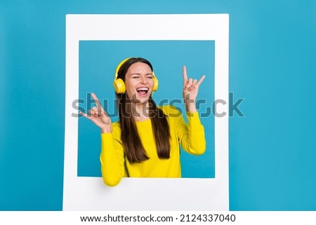 Photo of cool millennial brunette lady listen music show rock wear shirt headphones isolated on blue background