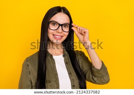 Photo of nice young lady wear spectacles khaki outfit isolated on yellow color background