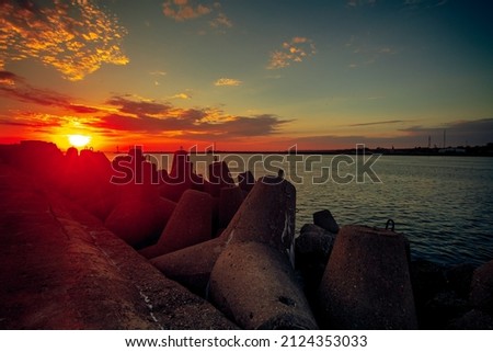 A Beautiful seascape with Colorful sunset at the gates to the Port of Klaipeda, Lithuania