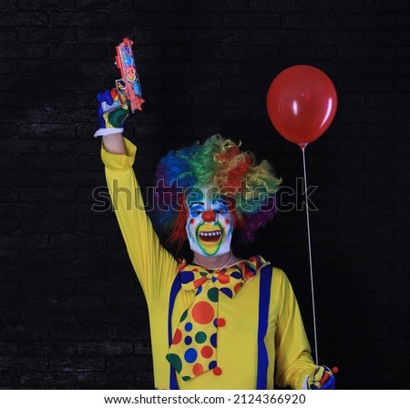 portrait of a bad clown on a black background
