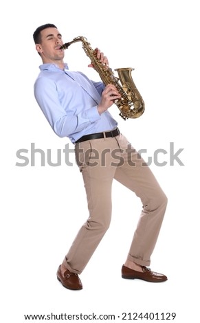 Young man playing saxophone on white background Royalty-Free Stock Photo #2124401129