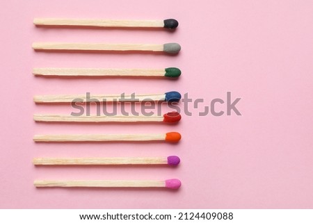 Different new matchsticks on pink background Royalty-Free Stock Photo #2124409088