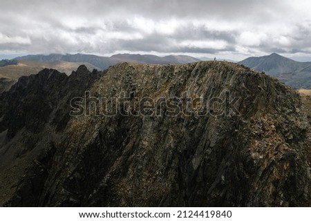 Person on the top of Pic dels Pessons in Andorra   Mountain Aerial Drone Shot Pyrenees