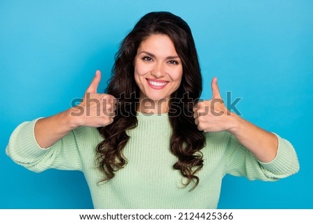 Photo of optimistic mature brunette lady show thumb up wear green sweater isolated on blue color background