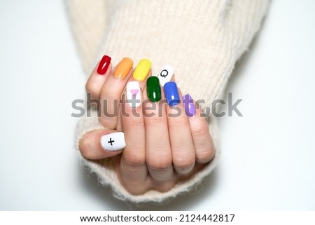 Woman hands with LGBT pride rainbow flag colours manicure isolated on white background.  Royalty-Free Stock Photo #2124442817