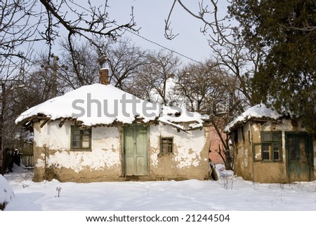 a traditional mud built farmhouse in winter