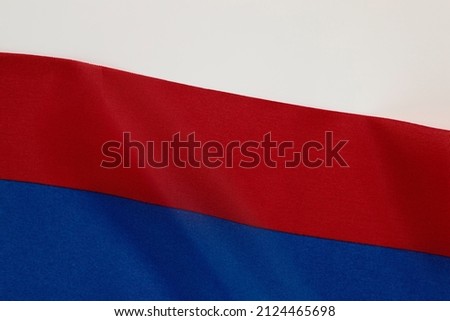 Russia flag waving with the wind. Texture of the background of the flag of the Russian Federation.