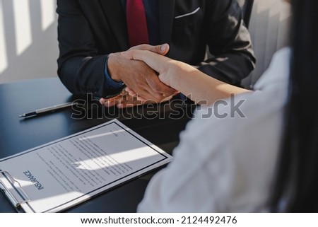 Businessmen shaking hands to congratulate real estate brokers about insurance broker contract agreement for home insurance, home buying and selling ideas and insurance