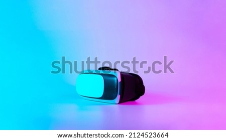 VR glasses virtual reality. 3d digital headset on futuristic neon tech background. Future Modern technology concept. VR gaming