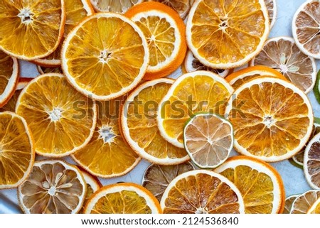 dried citrus fruits on a grey metallic background, space for text. High quality photo