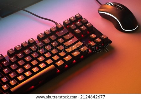 Red gaming keyboard. Keyboard with mouse, neon light. Mechanical keyboard with Red light. gaming concept. hacker concept. Royalty-Free Stock Photo #2124642677