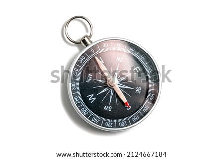Compass with a black dial isolate on a white background. Traditional navigation device indicating the cardinal points (north, south, east, and west). Royalty-Free Stock Photo #2124667184