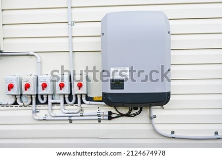 Large household solar inverter with five DC isolating switches  Royalty-Free Stock Photo #2124674978