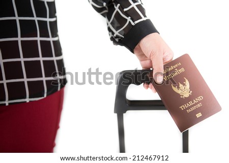 Traveling businessman handing passport - airport security concept.  Image of a persons hand holding a passport. Separate the white background