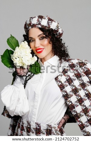 Perfect woman face. Beauty woman with white hydrangea.