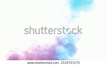 An explosion of colored paints in water on a white background