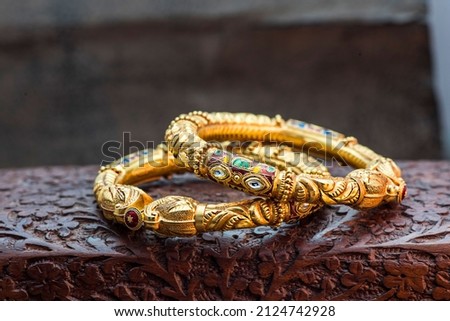 Indian Design Gold Bangle Jewelry Royalty-Free Stock Photo #2124742928
