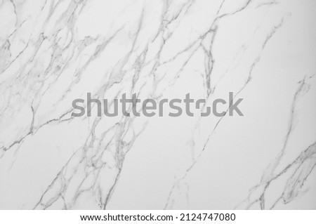 Natural stone texture of white Carrara marble, layered texture with dark veins